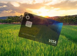 a credit card in a field of grass