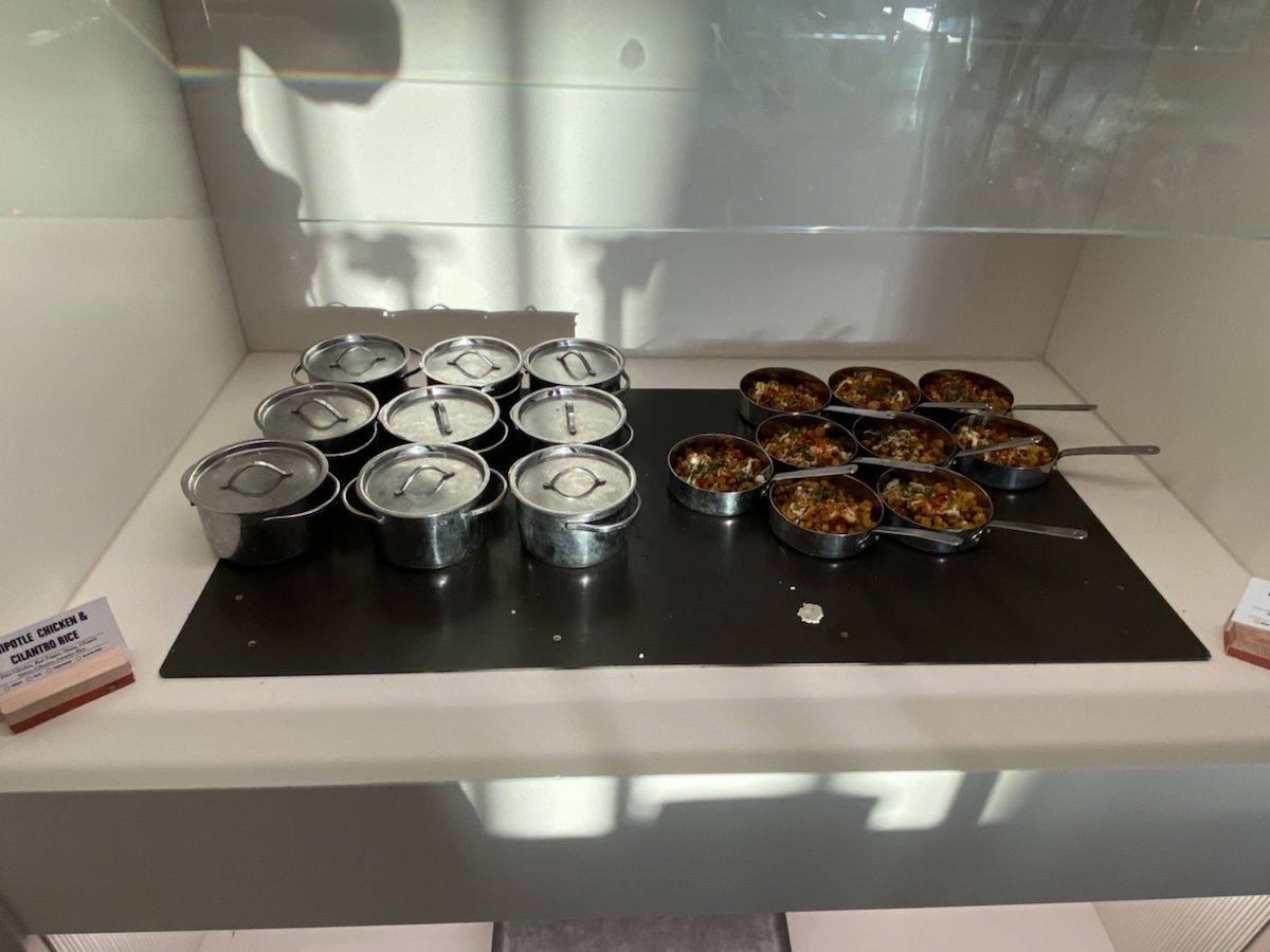 a group of food in containers on a black surface