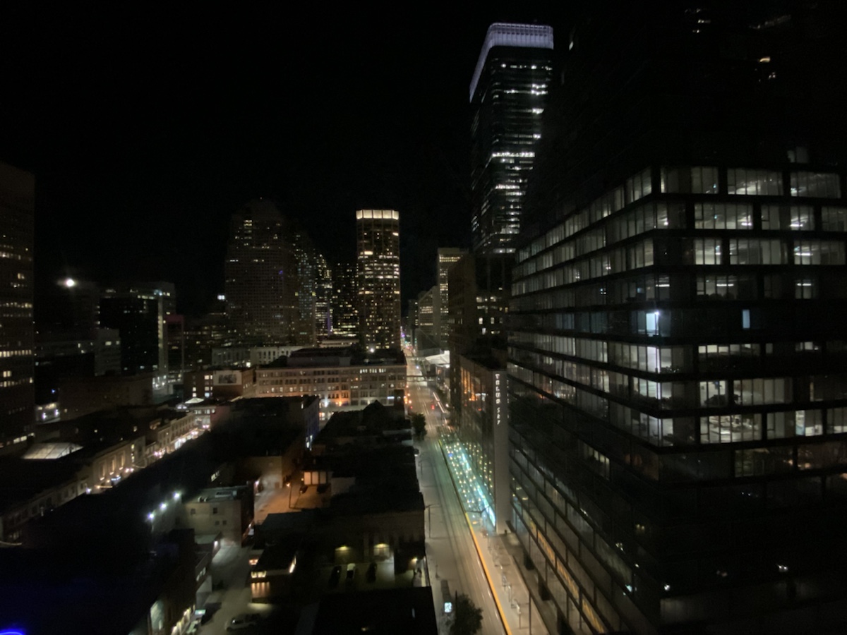 a city at night with many tall buildings