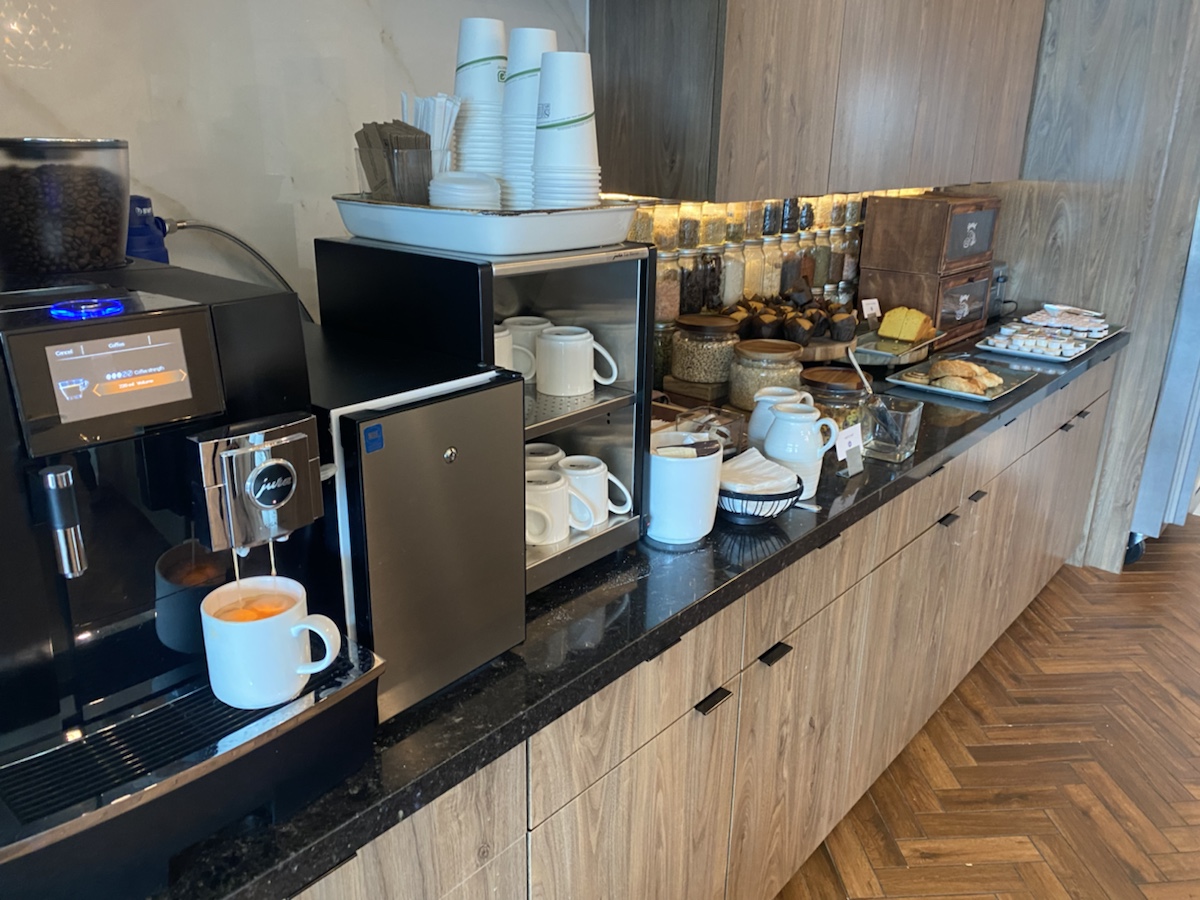 a counter with coffee and tea cups