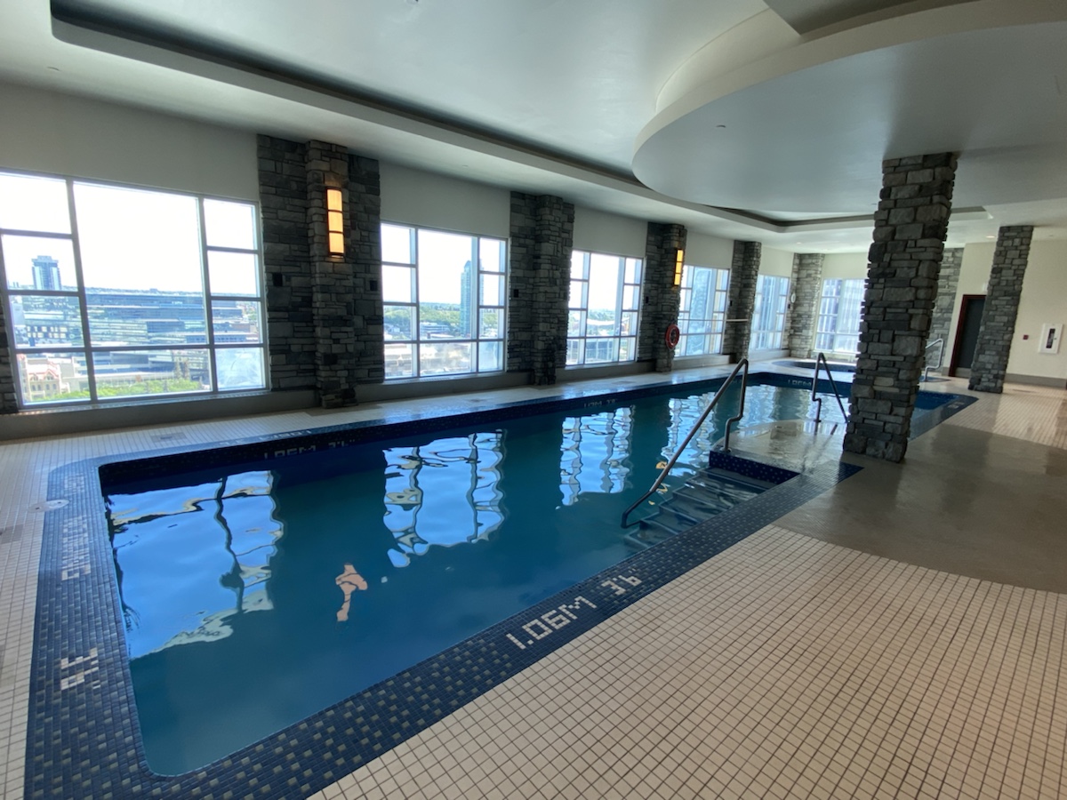 a indoor pool with a railing