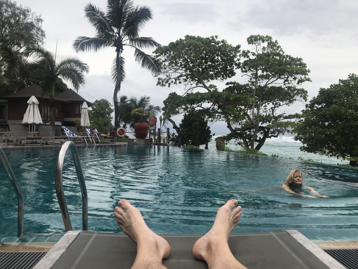 a person's feet on a pool