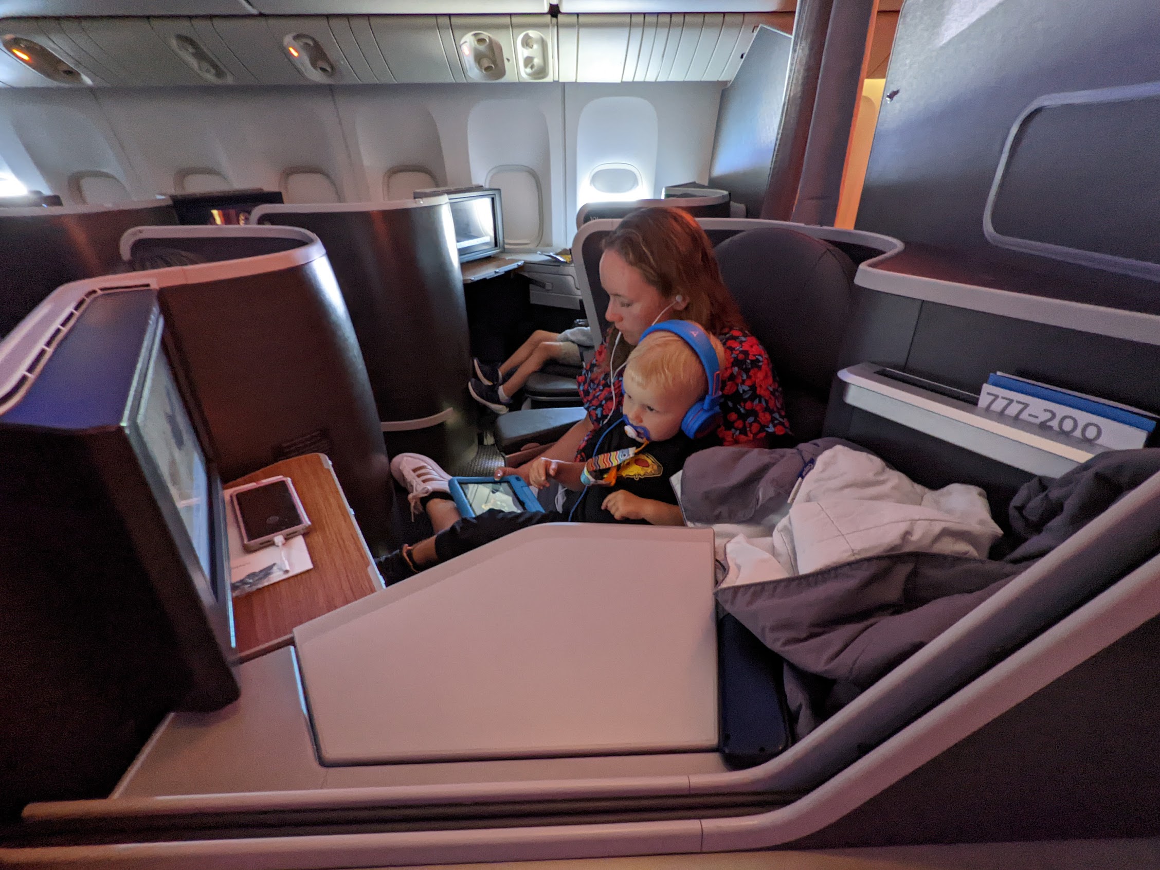 a woman and a child sitting in an airplane