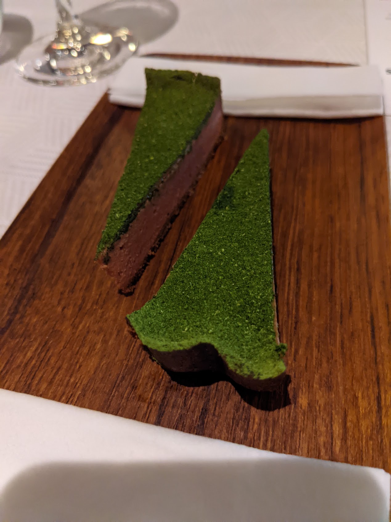 a piece of cake with green powder on top