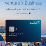 a credit card with a city in the background