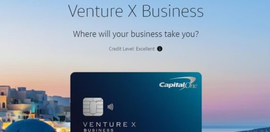 a credit card with a city in the background