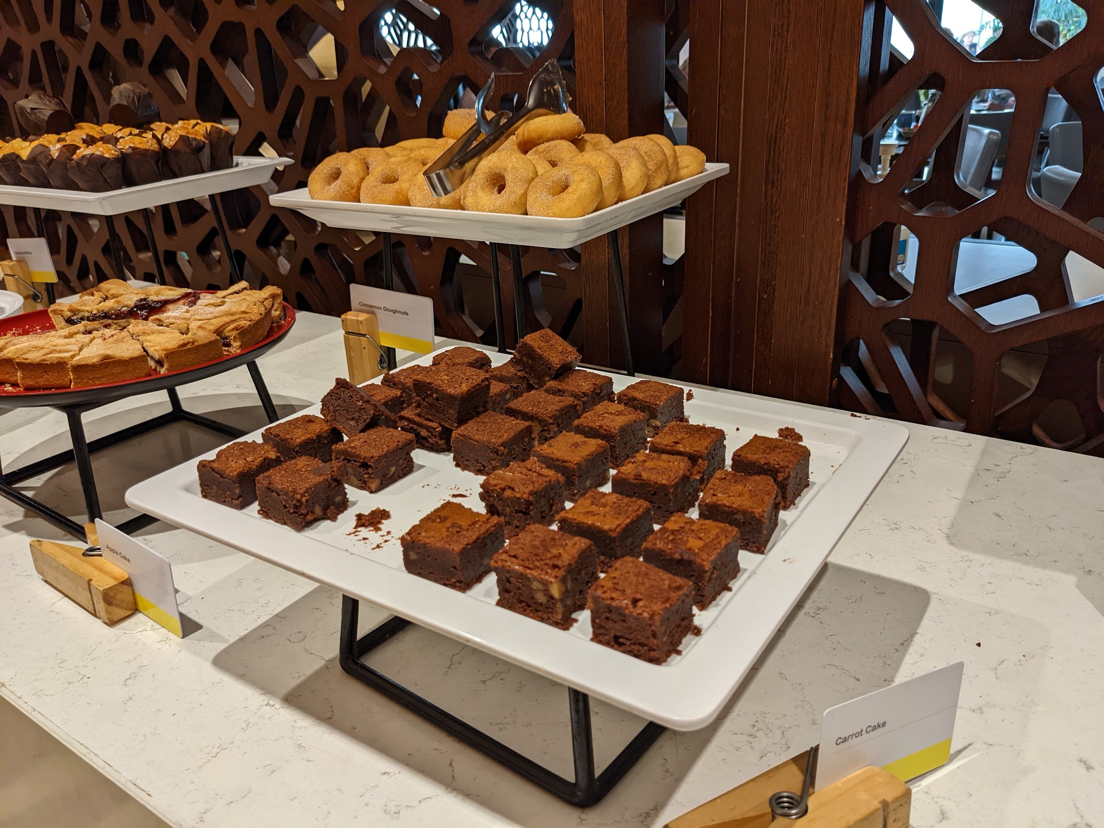 a tray of brownies and donuts on a table