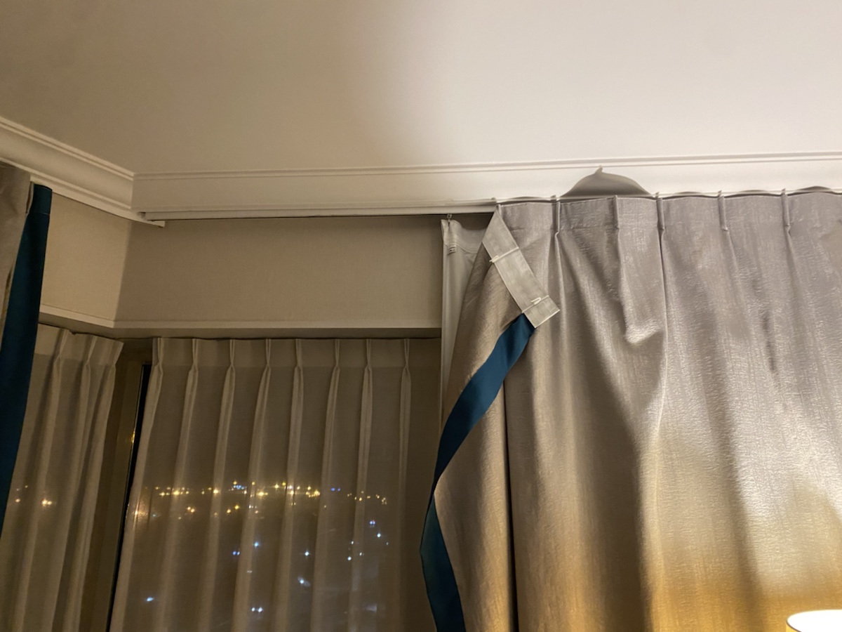 a curtain with a blue ribbon