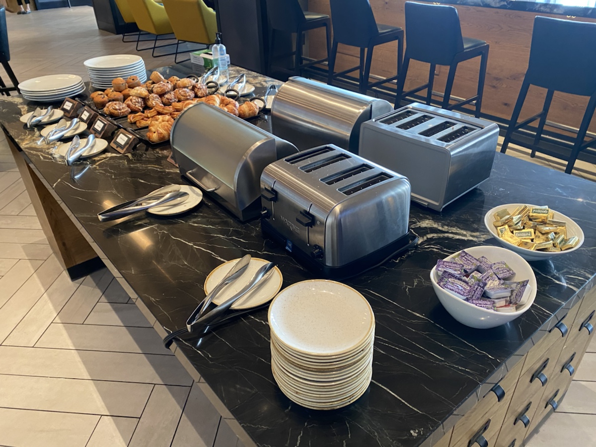 a buffet table with food and plates