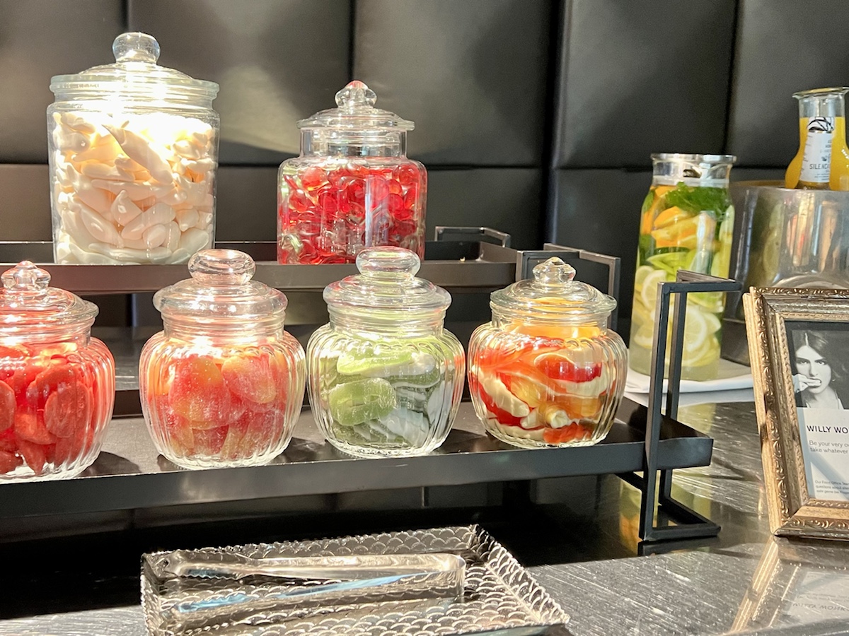 a group of glass jars with food on a shelf