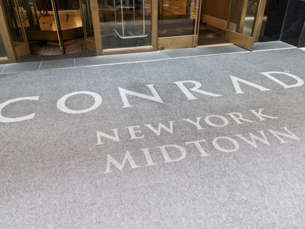 a grey carpet with white text on it