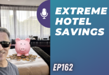 a person sitting on a bed with a piggy bank on it