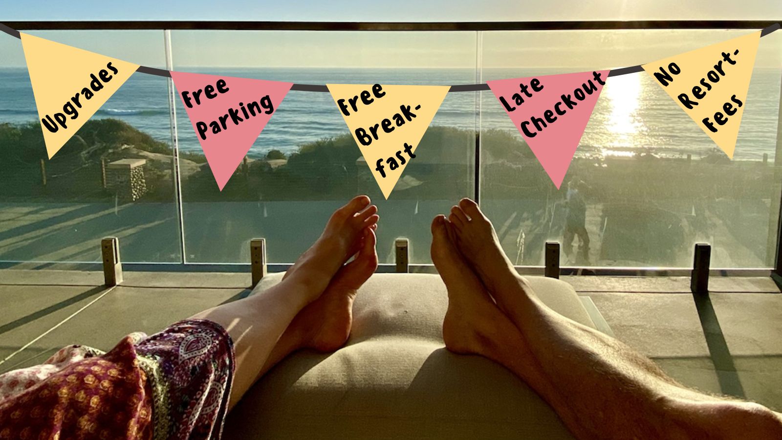 a person's feet on a couch with a flag from a balcony