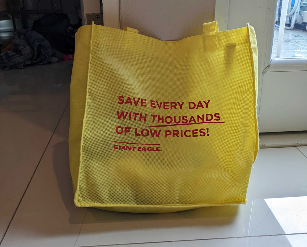 a yellow bag with red text on it