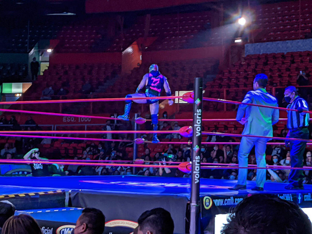 a man in a mask on a boxing ring