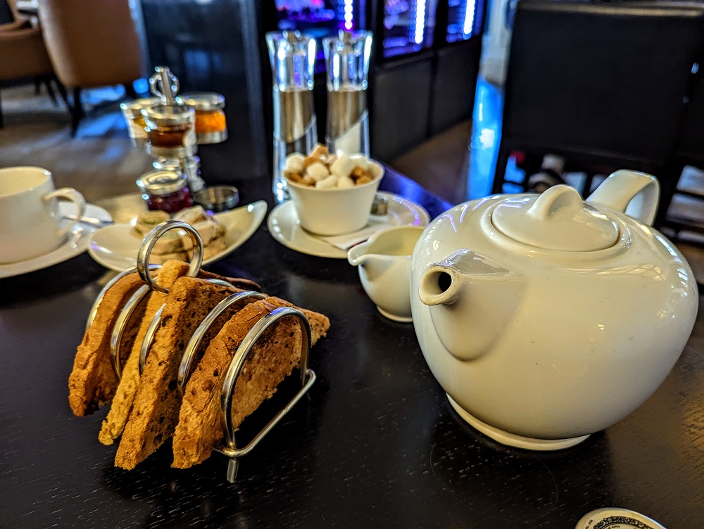 a table with a teapot and toast