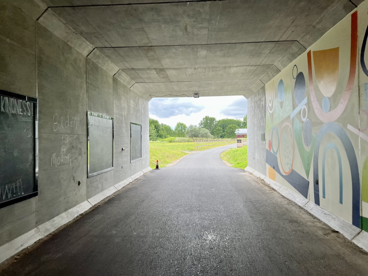 a tunnel with a painting on the side