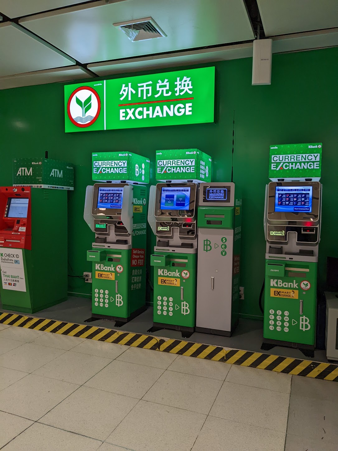 a row of green atm machines