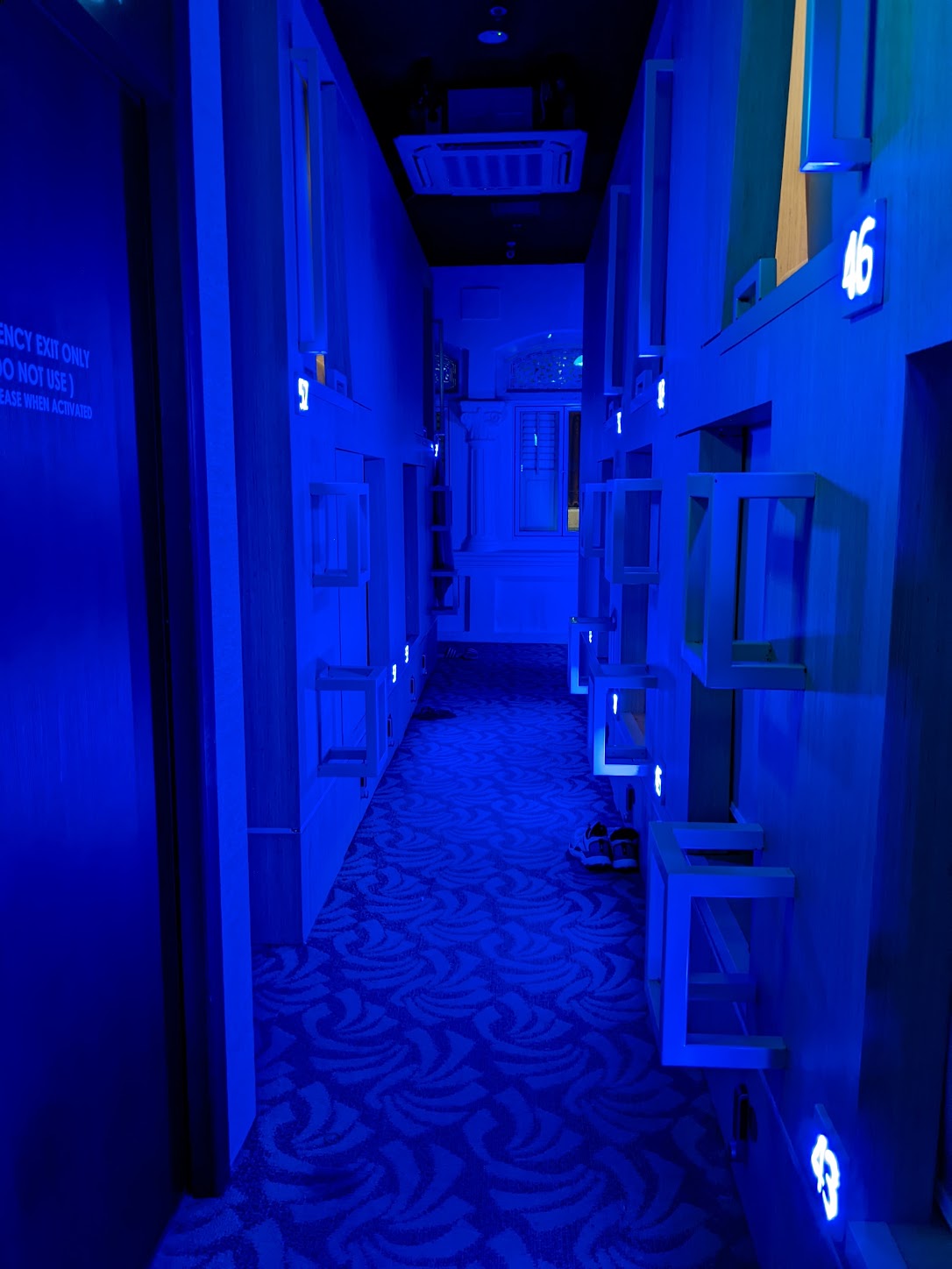 a hallway with blue lights
