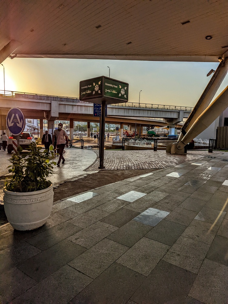 From Terminal 2, head towards this Assembly Point sign and walk to its left, following the subsequent blue signs