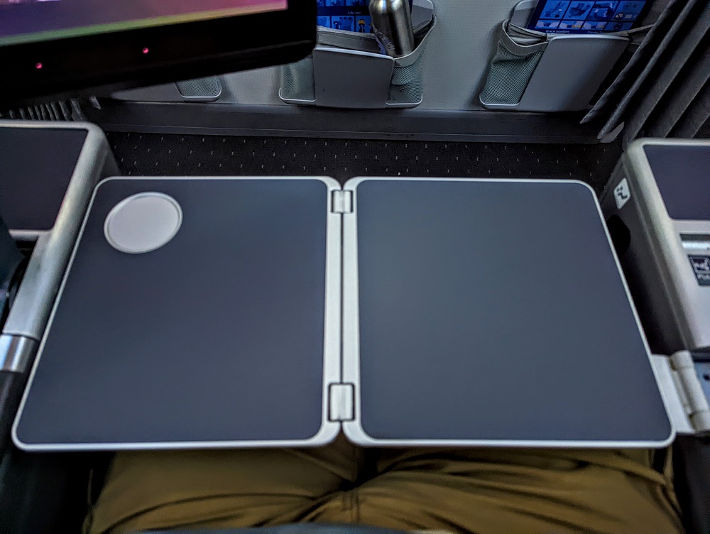 a pair of laptops on a seat
