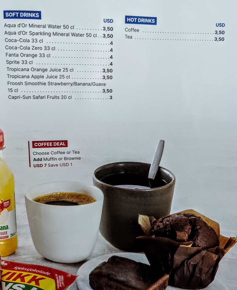 a menu with a cup of coffee and muffin