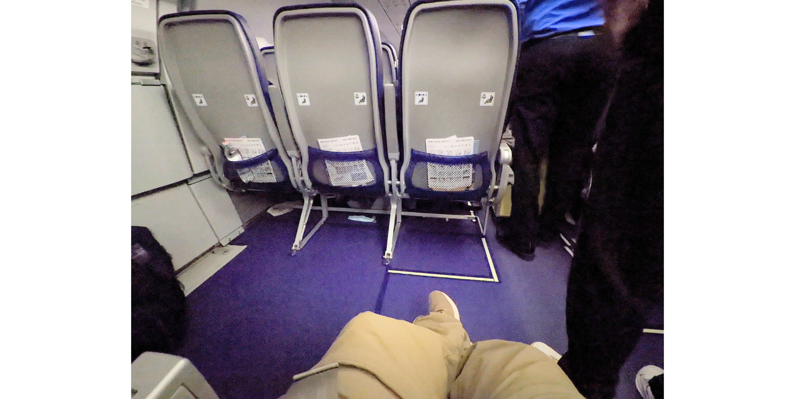 a row of chairs in an airplane