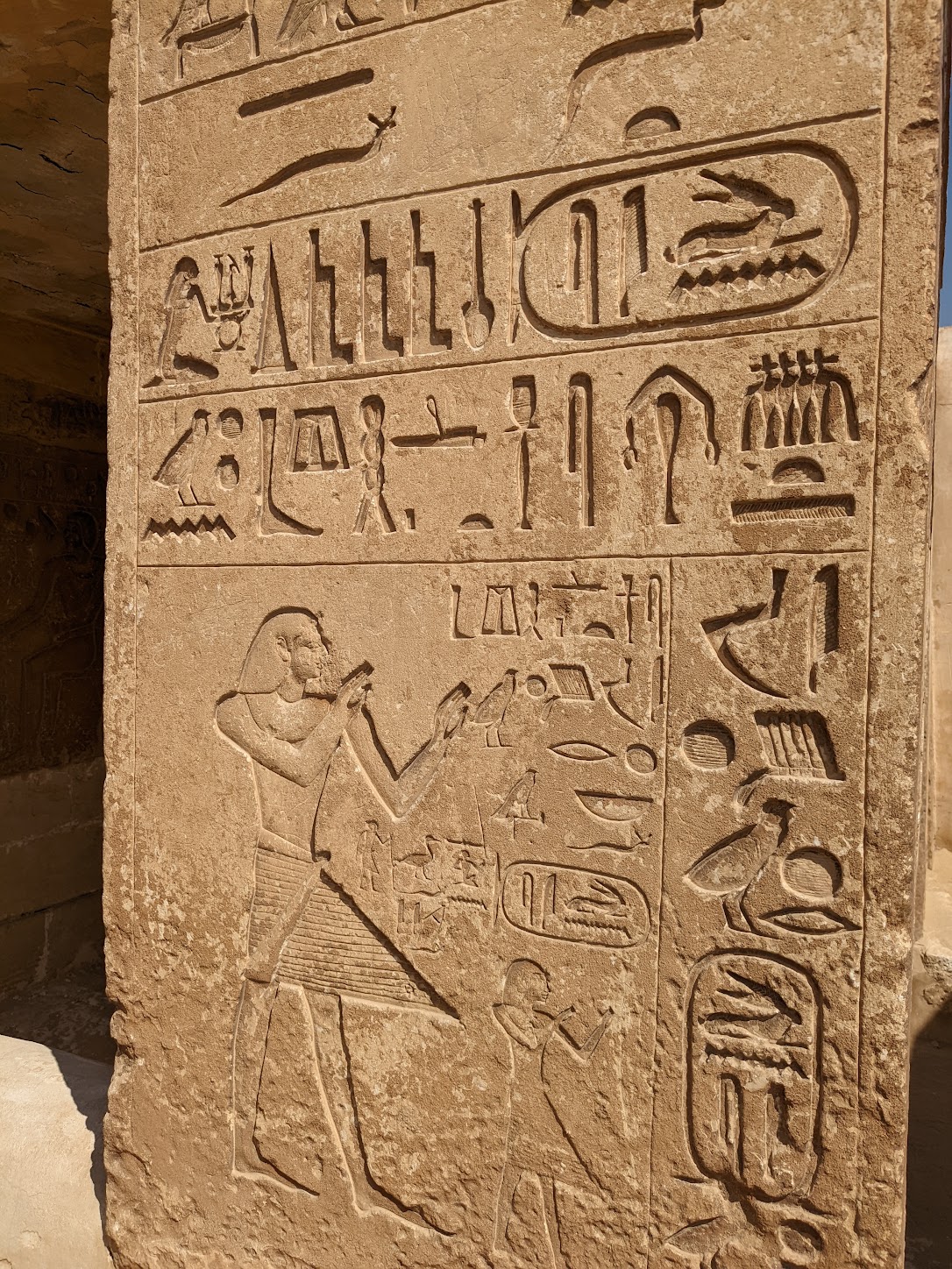 a stone wall with hieroglyphics