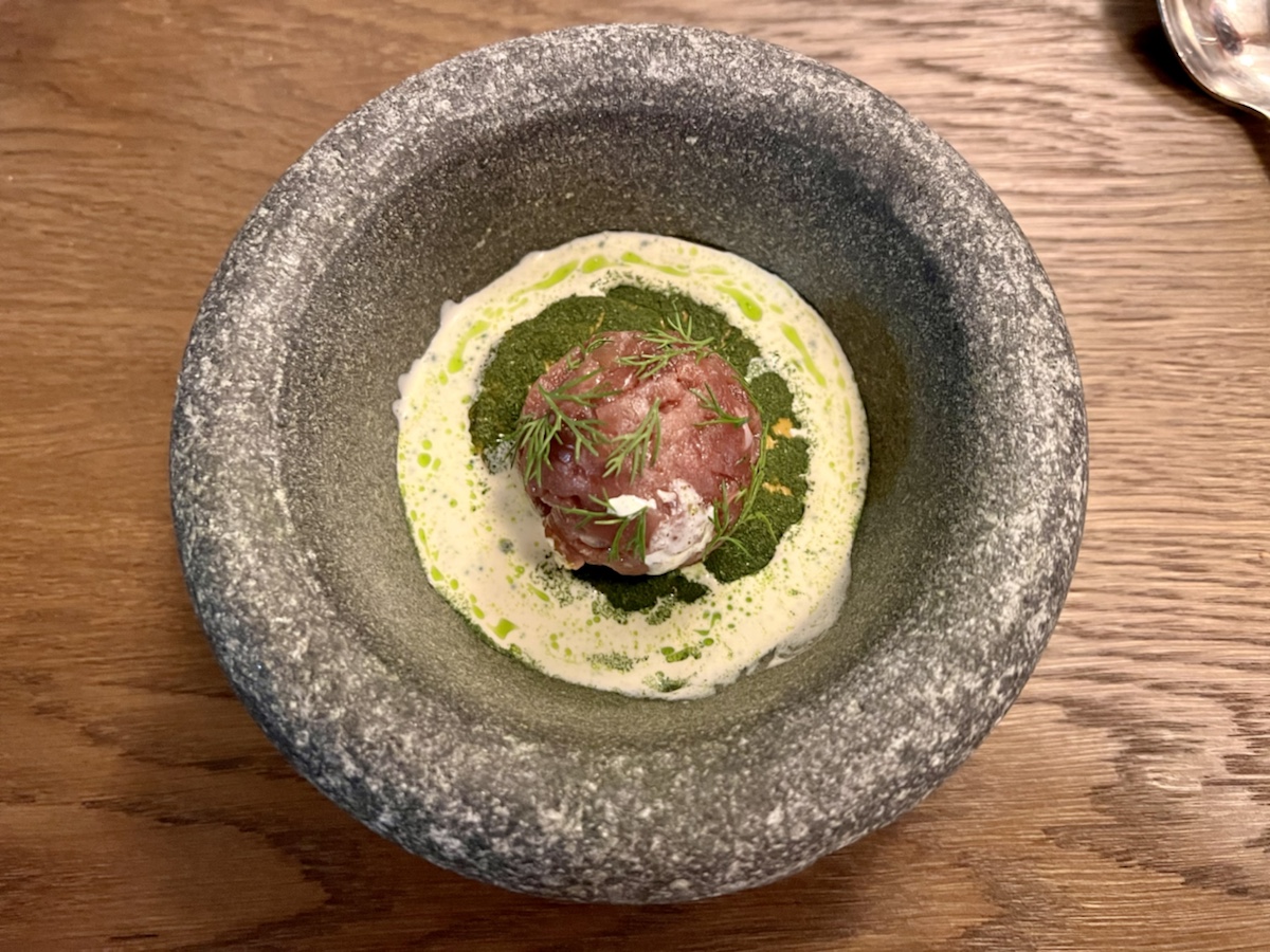 a round meat ball in a stone bowl