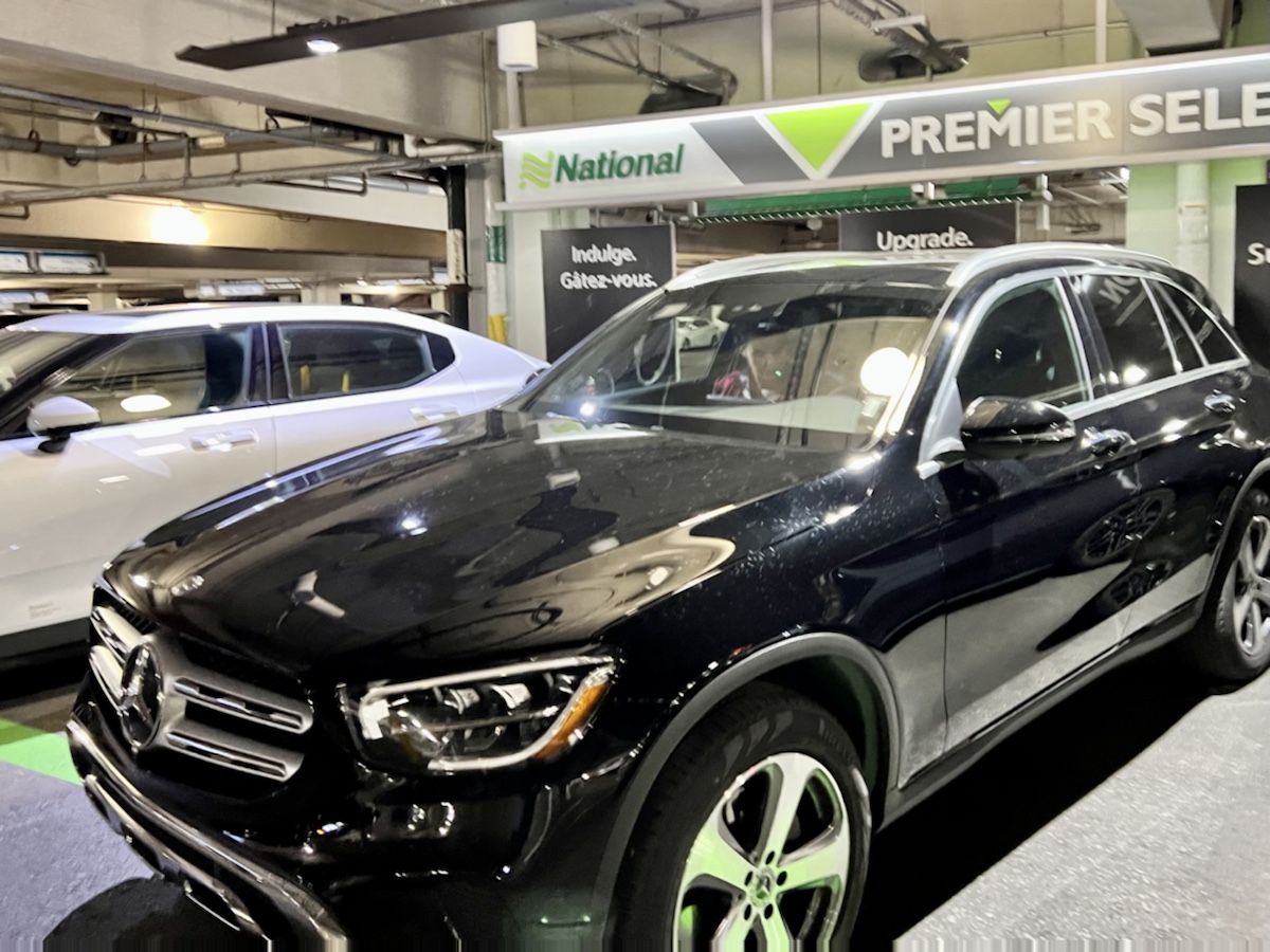 a black car parked in a building