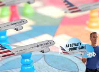 a man holding a sign next to a group of model airplanes