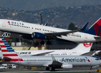 a group of airplanes on a runway