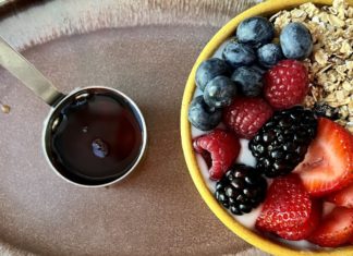 a bowl of fruit and a cup of liquid