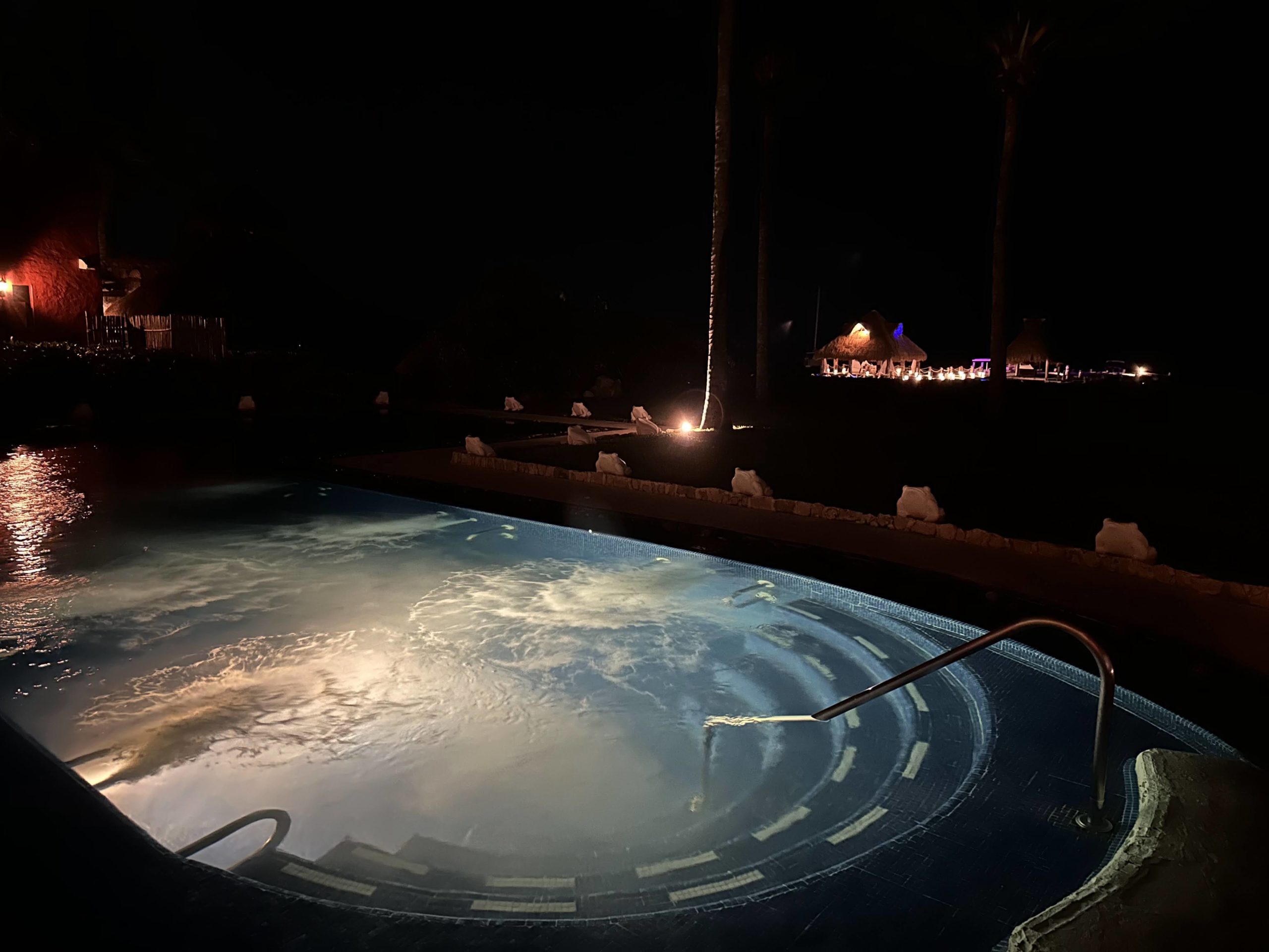 a pool with a light reflecting off the water