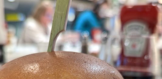 a burger with fries on a plate
