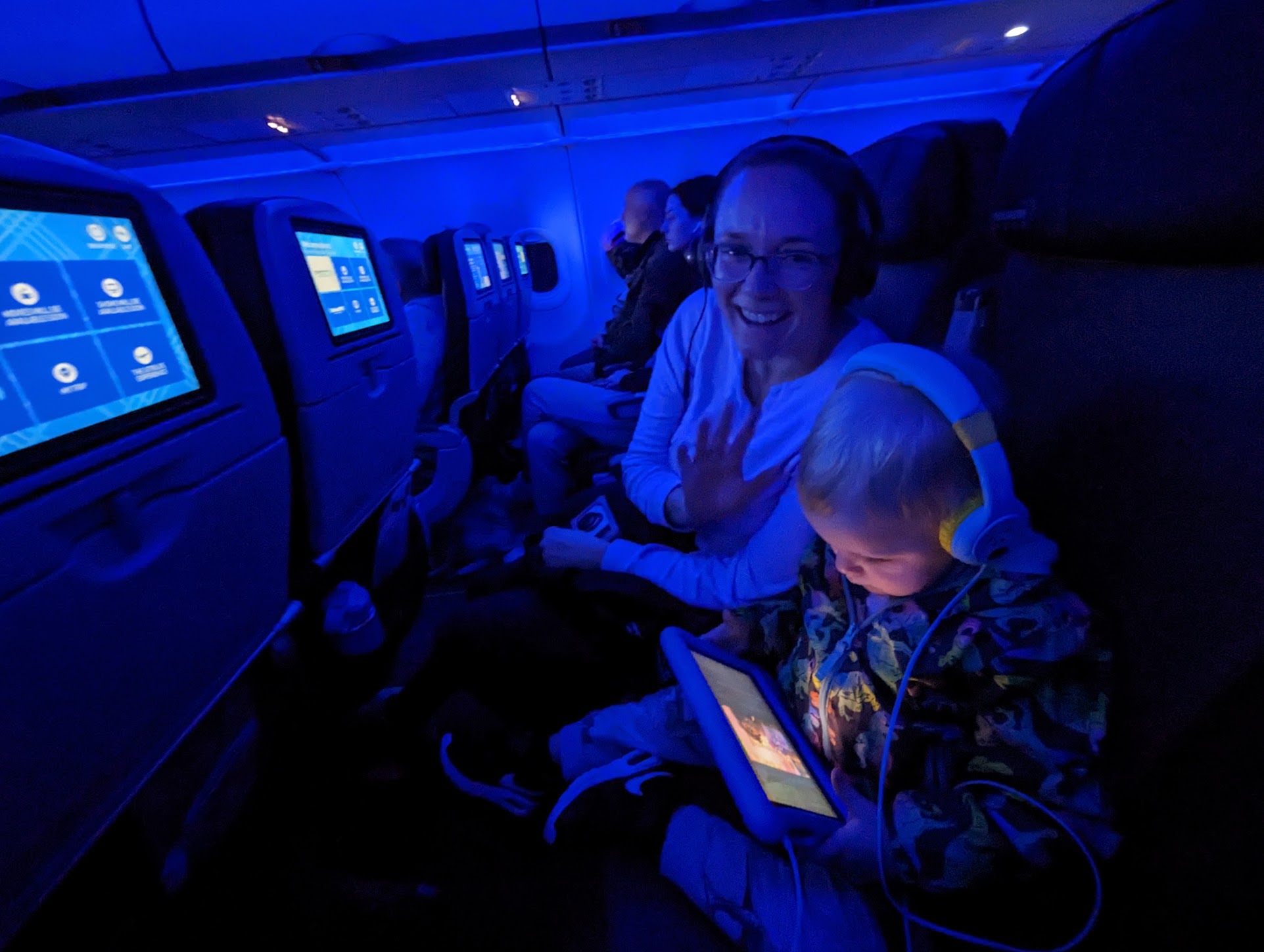 a woman and a child in an airplane