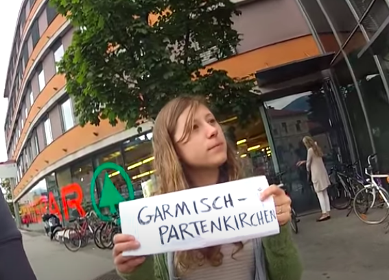 a girl holding a sign