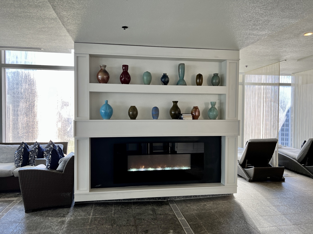 a fireplace with vases on it