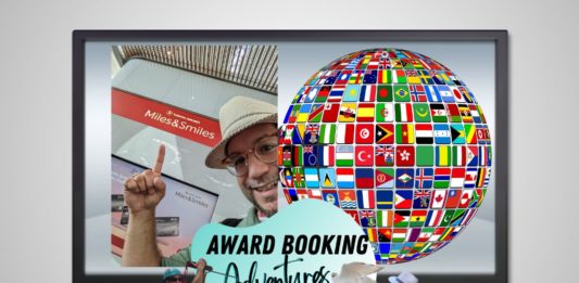 a man in a hat and glasses with a globe and a globe with flags