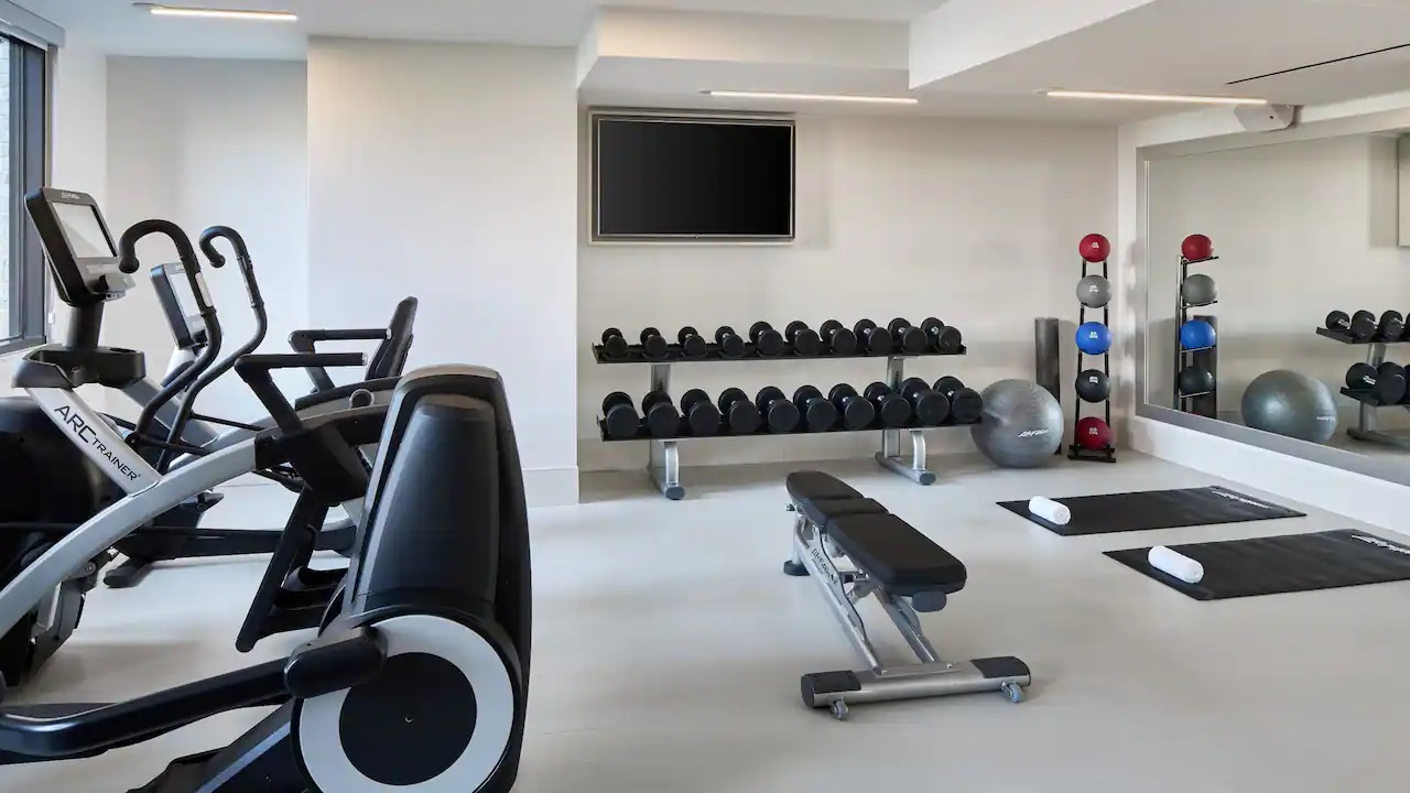 a room with weights and exercise equipment