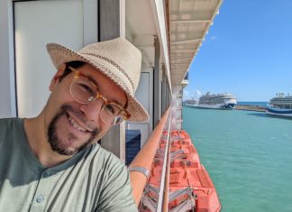 a man taking a selfie on a cruise ship