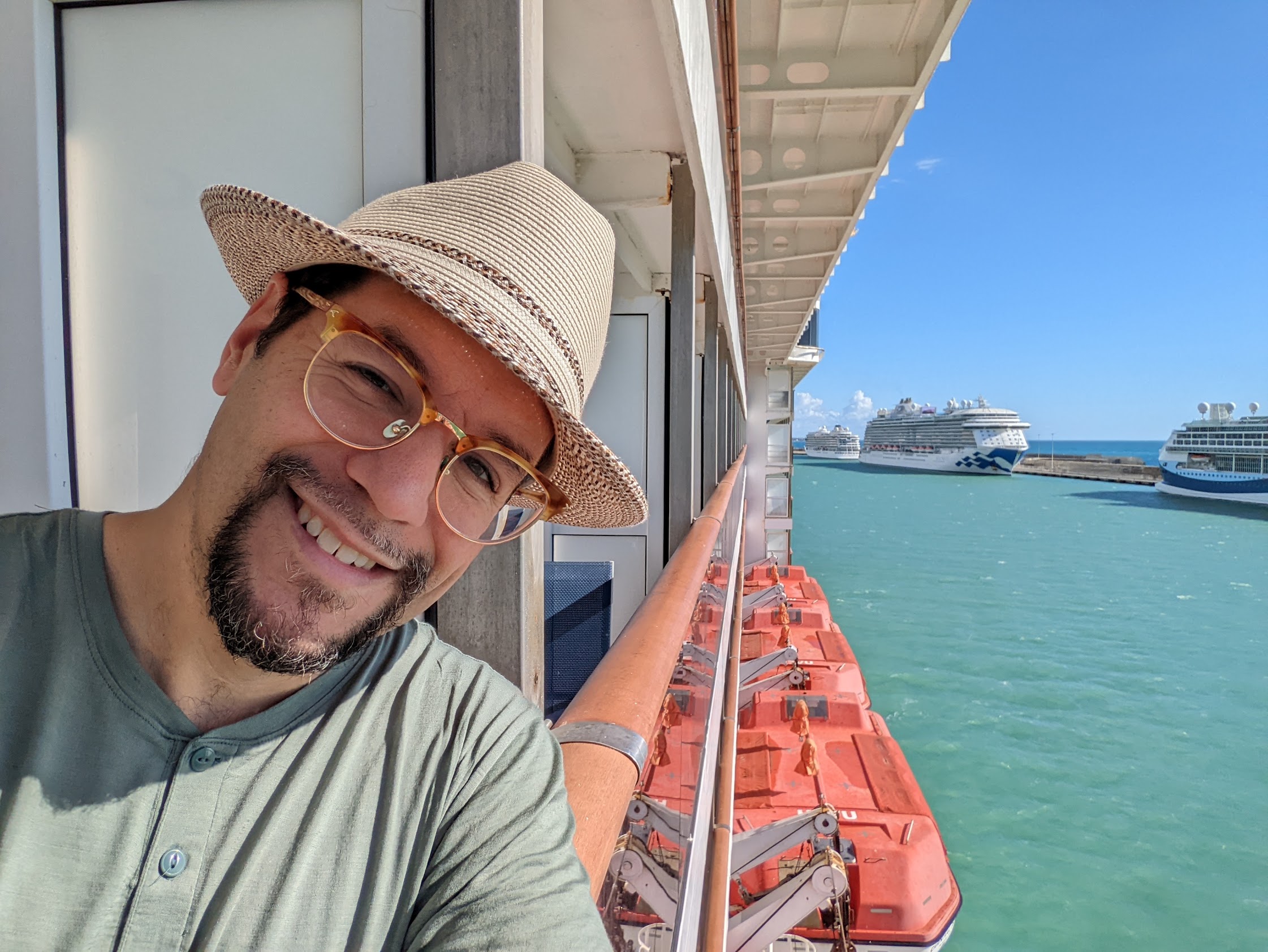 a man taking a selfie on a cruise ship