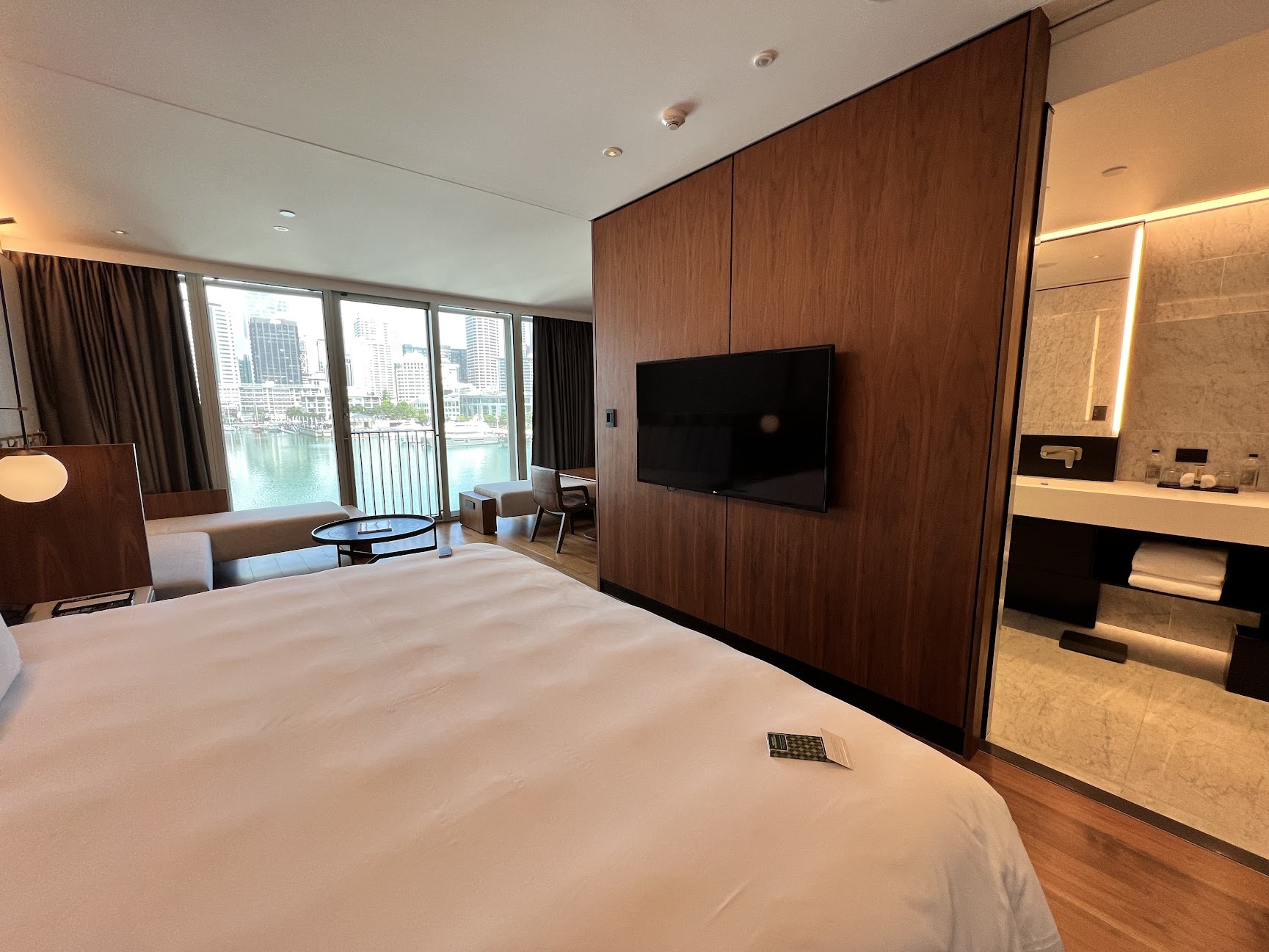 a room with a large bed and a television