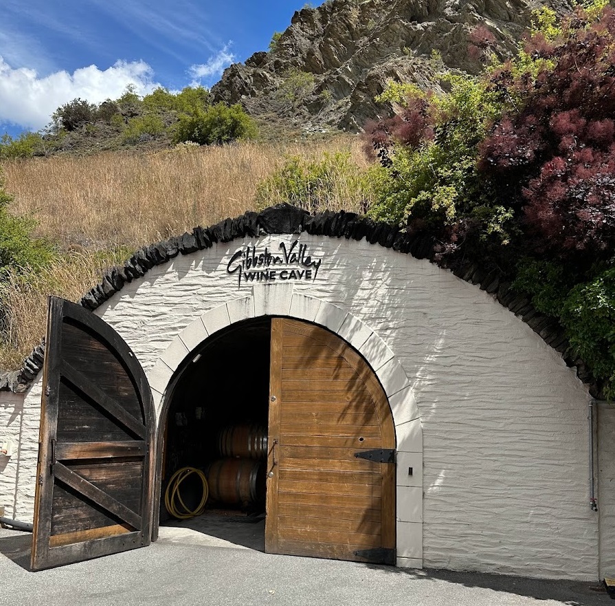 a wine cellar with a wooden door