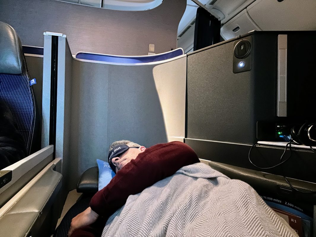 a man sleeping on a chair