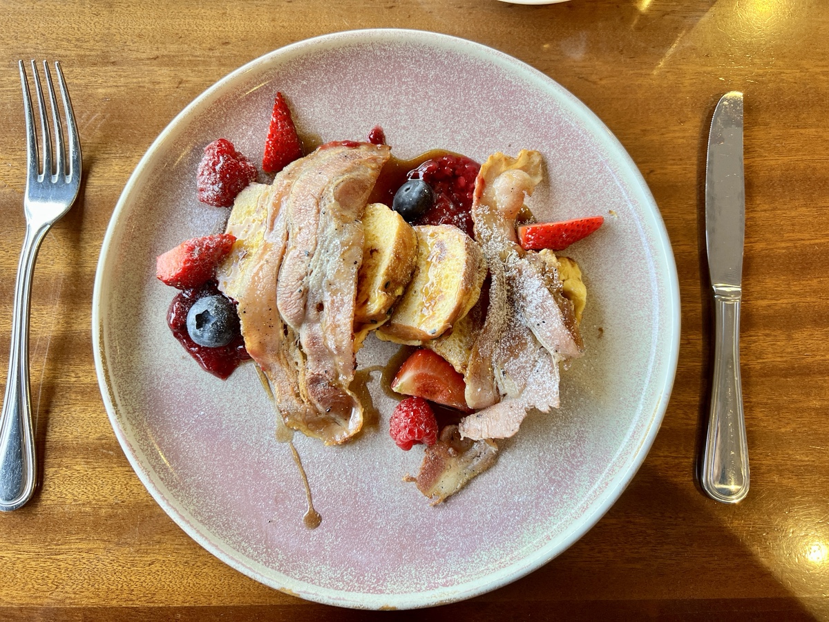 a plate of food with a knife and fork