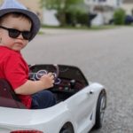 a child in a toy car
