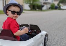 a child in a toy car