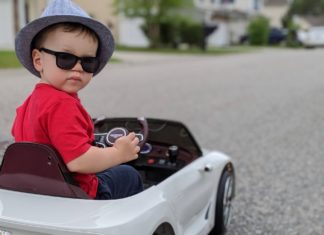 a child in a toy car