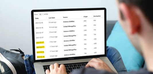 a person typing on a laptop